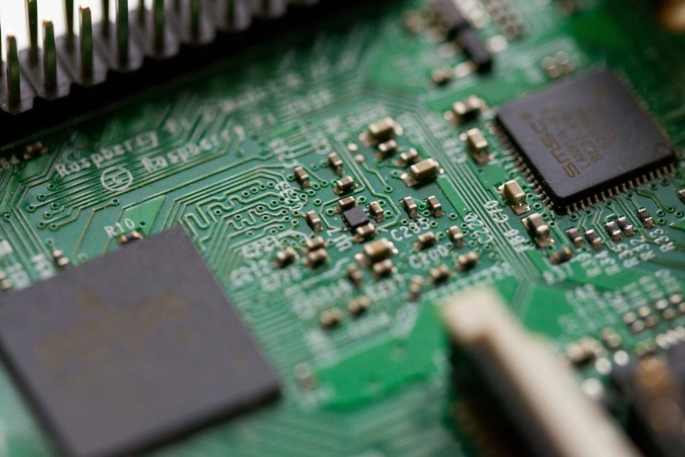 Macro shot of a circuit board showing components and traces