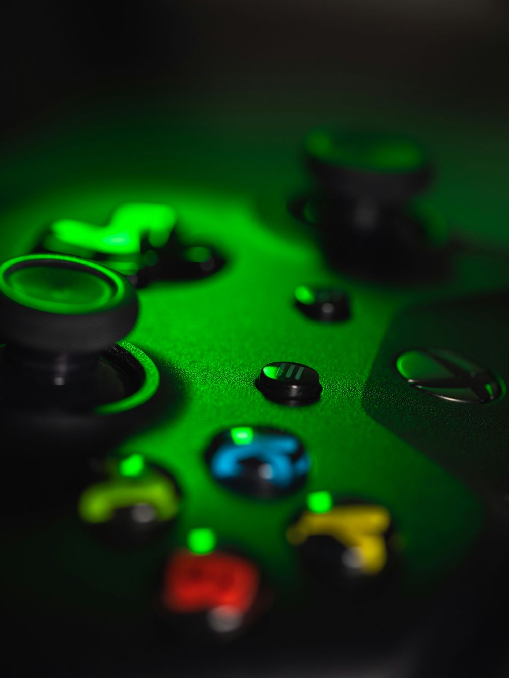 Xbox controller buttons lit in green
